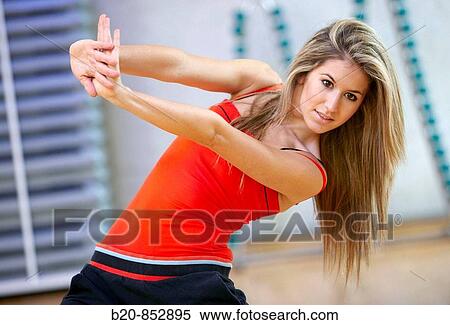Young woman in gym, dance exercise, aerobics, fitness View Large Photo Image Stock Photography - Young woman in gym, dance exercise, aerobics, fitness. Fotosearch