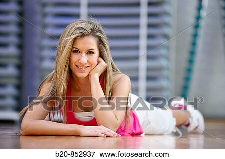 Young woman in gym View Large Photo Image Stock Photo - Young woman in gym. Fotosearch