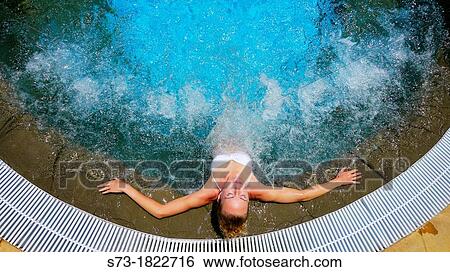 Young woman in jacuzzi View Large Photo Image Stock Photograph - Young woman in jacuzzi. Fotosearch