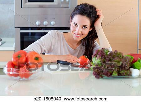 Young woman in kitchen View Large Photo Image Stock Image - Young woman in kitchen. Fotosearch