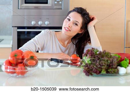 Young woman in kitchen View Large Photo Image Stock Photo - Young woman in kitchen. Fotosearch