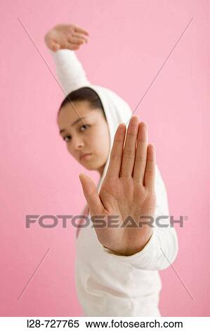 Young woman in martial arts pose View Large Photo Image Stock Photography - Young woman in martial arts pose. Fotosearch
