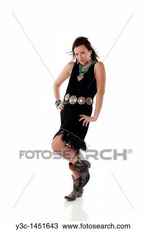 Stock Image - Young woman in native american outfit. Fotosearch