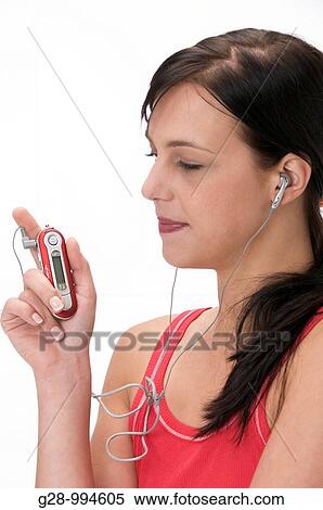 young woman in red top with her MP3 player View Large Photo Image Stock Photography - young woman in red top with her MP3 player. Fotosearch