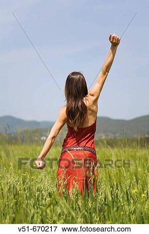 Stock Photo - Young woman in the countryside. Fotosearch