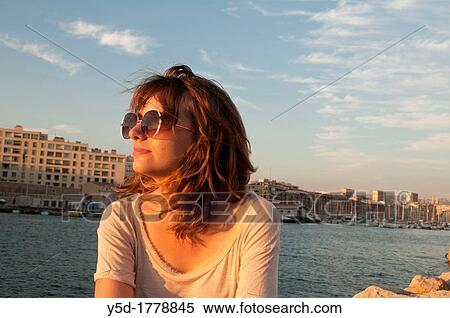 young woman in the old harbour of Marseille at sunset, Vieux-Port, Marseille, Bouches-du-Rhone, Provence- Alpes-Cote d? Azur, France, Europe View Large Photo Image Stock Photography - young woman in the old harbour of Marseille at sunset, Vieux-Port, Marseille, Bouches-du-Rhone, Provence- Alpes-Cote d? Azur, France, Europe. Fotosearch