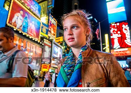 Young woman in Times Square, New York City View Large Photo Image Stock Photo - Young woman in Times Square, New York City. Fotosearch
