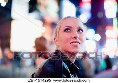 Stock Photography - Young woman in Times Square New York. Fotosearch