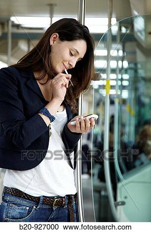 Stock Image - Young woman in tram, Vitoria, Alava, Basque Country, Spain. Fotosearch