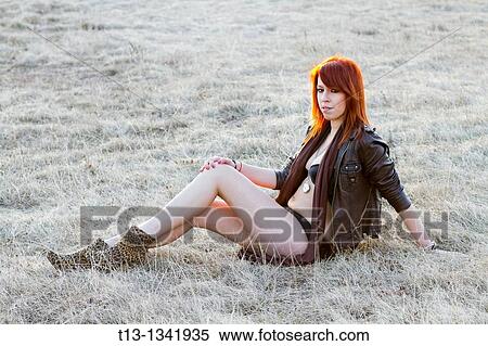 Young woman in undies is resting on the grass field View Large Photo Image Stock Photography - Young woman in undies is resting on the grass field. Fotosearch