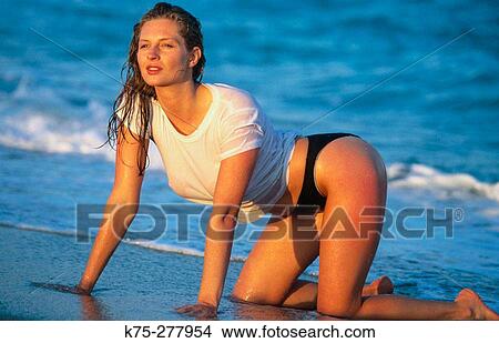 young woman in wet tee shirt View Large Photo Image Picture - young woman in wet tee shirt. Fotosearch