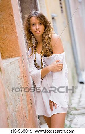 Stock Photography - Young woman in White robe with bare shoulder. Fotosearch
