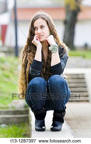 Young woman is considering View Large Photo Image Stock Photo - Young woman is considering. Fotosearch