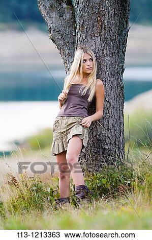 Young woman is teasing with exposed thigh View Large Photo Image Stock Image - Young woman is teasing with exposed thigh. Fotosearch