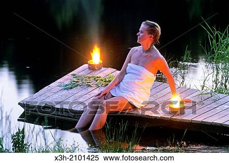 young woman just leaving sauna and sitting on a pontoon, Finland, Northern Europe. View Large Photo Image Stock Photography - young woman just leaving sauna and sitting on a pontoon, Finland, Northern Europe.. Fotosearch