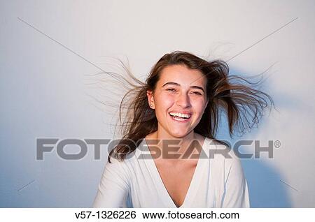 Stock Photograph - Young woman laughing. Fotosearch