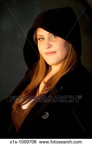Stock Photograph - Young woman likes the camera. Fotosearch