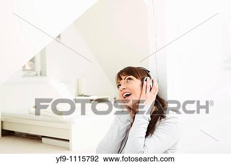 Young woman listening music. View Large Photo Image Stock Image - Young woman listening music.. Fotosearch