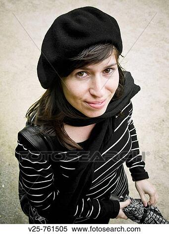 Stock Photography - Young woman looking at camera. Paris, France. Fotosearch