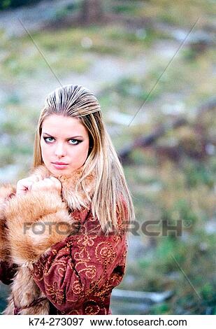 Stock Photo - Young Woman Looking At Camera. Fotosearch