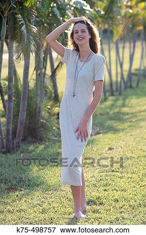 Stock Photo - Young woman looking at camera. Fotosearch