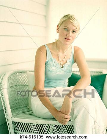 Stock Photography - Young woman looking at camera. Fotosearch