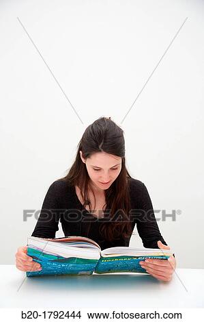 Young woman looking at exhibition catalog. David Hockney,? A Bigger Picture? exhibition, Guggenheim Museum, Bilbao, Biscay, Basque Country, Spain View Large Photo Image Picture - Young woman looking at exhibition catalog. David Hockney,? A Bigger Picture? exhibition, Guggenheim Museum, Bilbao, Biscay, Basque Country, Spain. Fotosearch