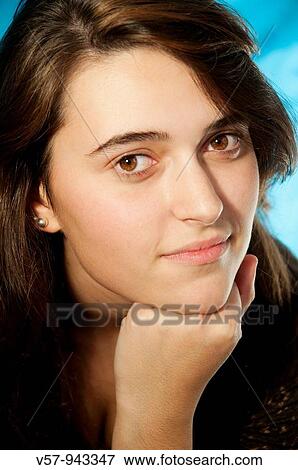 Young woman looking at the camera. Close view. View Large Photo Image Stock Photo - Young woman looking at the camera. Close view.. Fotosearch