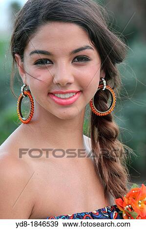 Stock Photo - Young woman looking at the camera, Miami Beach, Florida, USA. Fotosearch