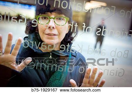 young woman looking through a window inside in Tate Modern, South Bank, London, England, UK View Large Photo Image Stock Photo - young woman looking through a window inside in Tate Modern, South Bank, London, England, UK. Fotosearch