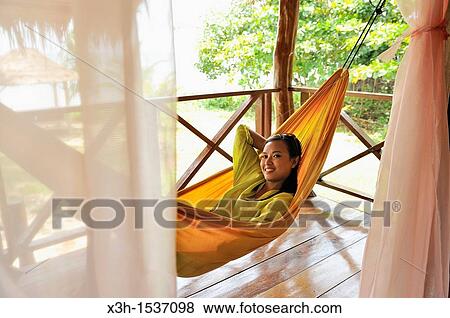 Young woman lying in hammock, Koh Jum Lodge, Koh Jum Island, Krabi, Thailand, Asia View Large Photo Image Stock Photo - Young woman lying in hammock, Koh Jum Lodge, Koh Jum Island, Krabi, Thailand, Asia. Fotosearch