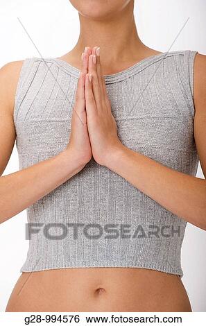 young woman meditating with hands together close up View Large Photo Image Stock Photograph - young woman meditating with hands together close up. Fotosearch