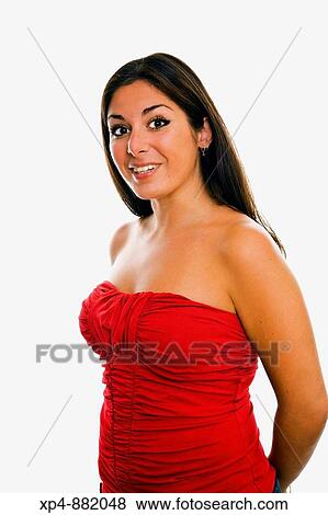 Young woman of Middle Eastern descent with long dark hair poses in red top with hands behind her back. View Large Photo Image Stock Photo - Young woman of Middle Eastern descent with long dark hair poses in red top with hands behind her back.. Fotosearch