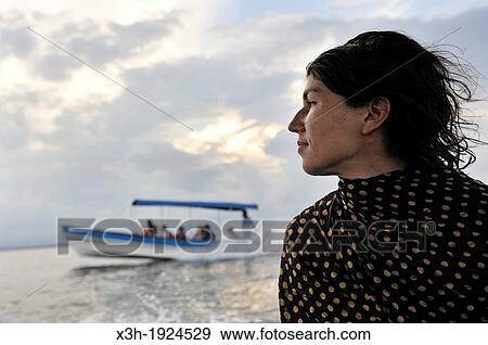 Stock Photo - young woman on a boat trip around Colon Island, Bocas del Toro Archipelago, Republic of Panama, Central America. Fotosearch
