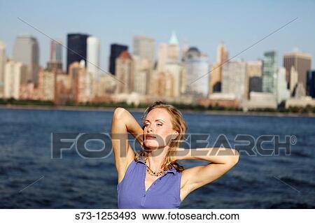 Stock Image - Young woman on a ferryboat, Manhattan, New York, USA. Fotosearch