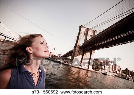 Young woman on a ferryboat, Manhattan, New York, USA View Large Photo Image Stock Image - Young woman on a ferryboat, Manhattan, New York, USA. Fotosearch