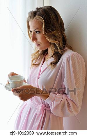 Young woman on bed in hotel room View Large Photo Image Stock Photo - Young woman on bed in hotel room. Fotosearch