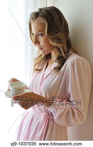 Young woman on bed in hotel room View Large Photo Image Stock Photography - Young woman on bed in hotel room. Fotosearch