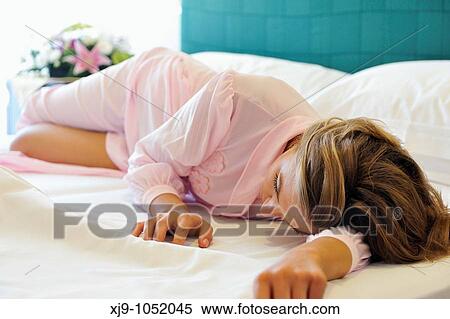Young woman on bed in hotel room View Large Photo Image Stock Photography - Young woman on bed in hotel room. Fotosearch