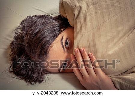 Young woman on her bed. View Large Photo Image Stock Photo - Young woman on her bed.. Fotosearch