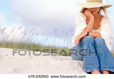 Young woman on sand dune thinking. View Large Photo Image Stock Image - Young woman on sand dune thinking.. Fotosearch