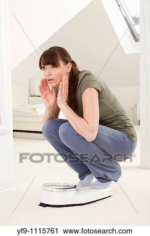 Young woman on scale. View Large Photo Image Stock Image - Young woman on scale.. Fotosearch