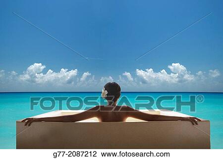 Stock Image - Young woman on the beach. Miami Beach, Florida, USA. Fotosearch