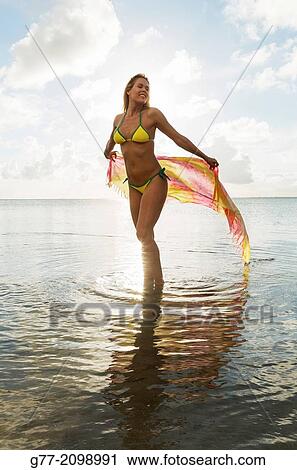 Young woman on the beach, Miami Beach, Florida, USA View Large Photo Image Stock Image - Young woman on the beach, Miami Beach, Florida, USA. Fotosearch