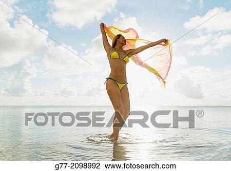 Young woman on the beach, Miami Beach, Florida, USA View Large Photo Image Stock Image - Young woman on the beach, Miami Beach, Florida, USA. Fotosearch