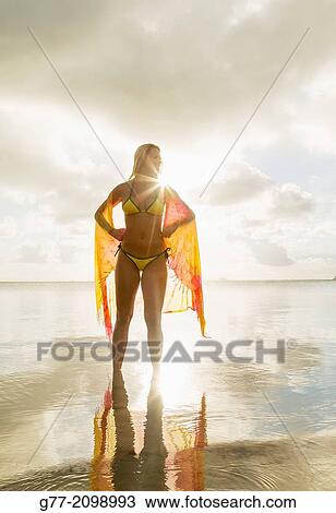 Young woman on the beach, Miami Beach, Florida, USA View Large Photo Image Stock Image - Young woman on the beach, Miami Beach, Florida, USA. Fotosearch