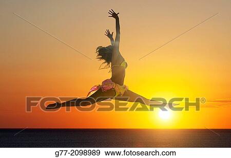 Young woman on the beach, Miami Beach, Florida, USA View Large Photo Image Stock Photo - Young woman on the beach, Miami Beach, Florida, USA. Fotosearch