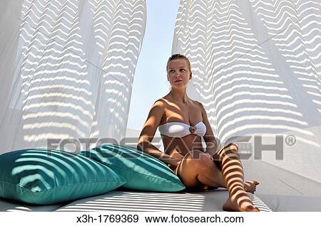 young woman on the spa terrace of the Almyra Luxury Spa Hotel, Paphos, Cyprus, Eastern Mediterranean Sea View Large Photo Image Stock Photo - young woman on the spa terrace of the Almyra Luxury Spa Hotel, Paphos, Cyprus, Eastern Mediterranean Sea. Fotosearch