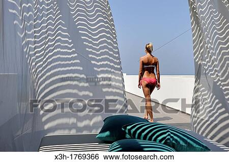 young woman on the spa terrace of the Almyra Luxury Spa Hotel, Paphos, Cyprus, Eastern Mediterranean Sea View Large Photo Image Stock Photograph - young woman on the spa terrace of the Almyra Luxury Spa Hotel, Paphos, Cyprus, Eastern Mediterranean Sea. Fotosearch