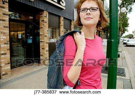 Young woman on the street View Large Photo Image Stock Photo - Young woman on the street. Fotosearch